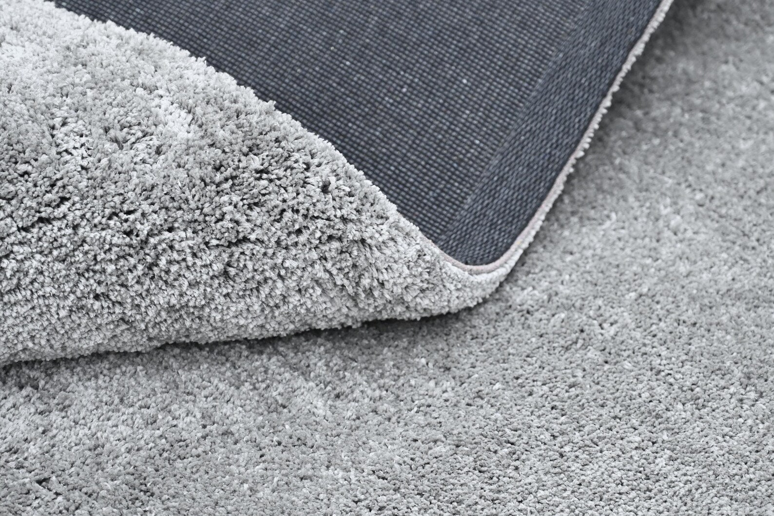 Starry Night Rug featuring white star motifs on a grey background for modern interiors