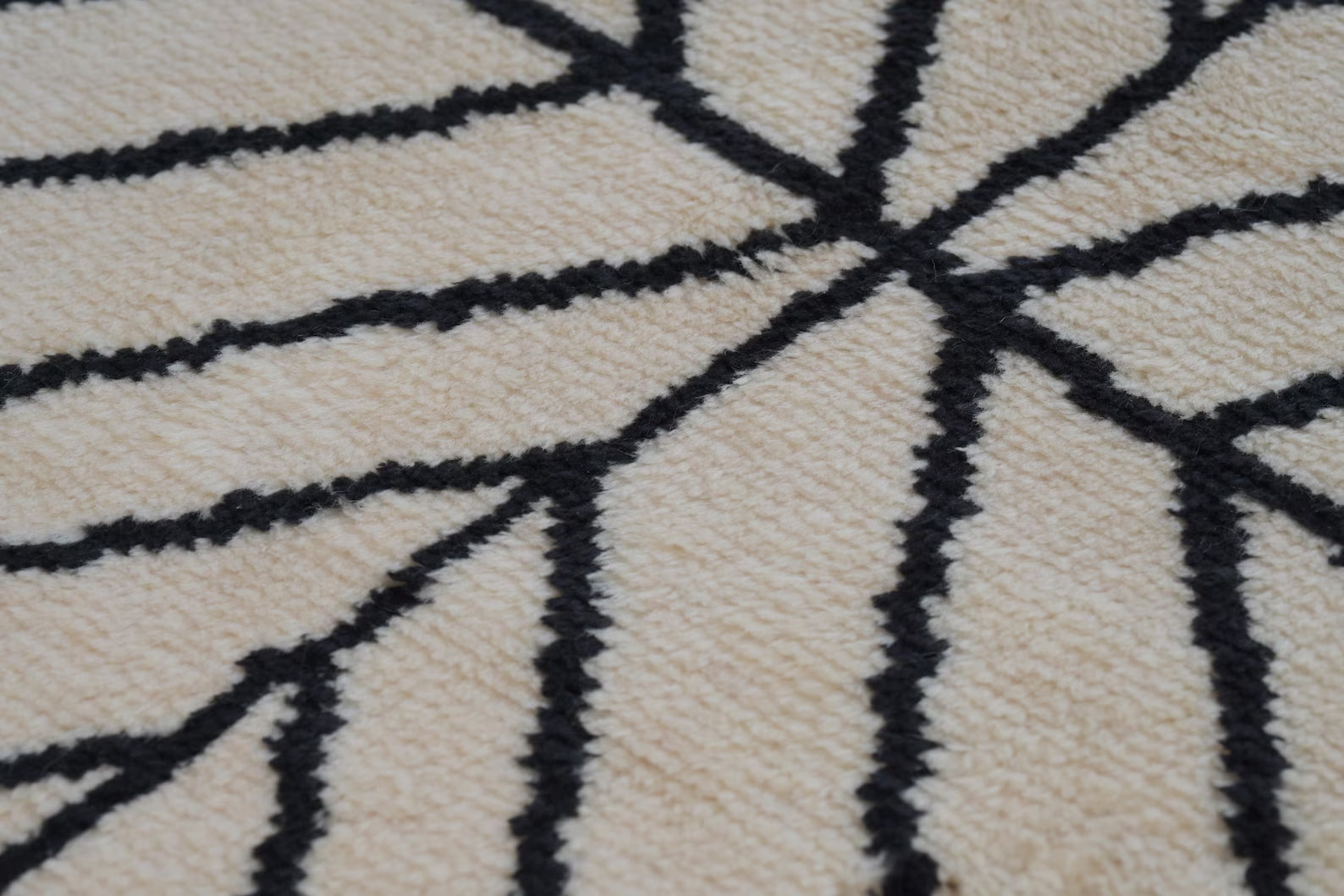 Side angle of Stemline Moroccan_hand_knotted Rug displaying even pile height and symmetrical design alignment.