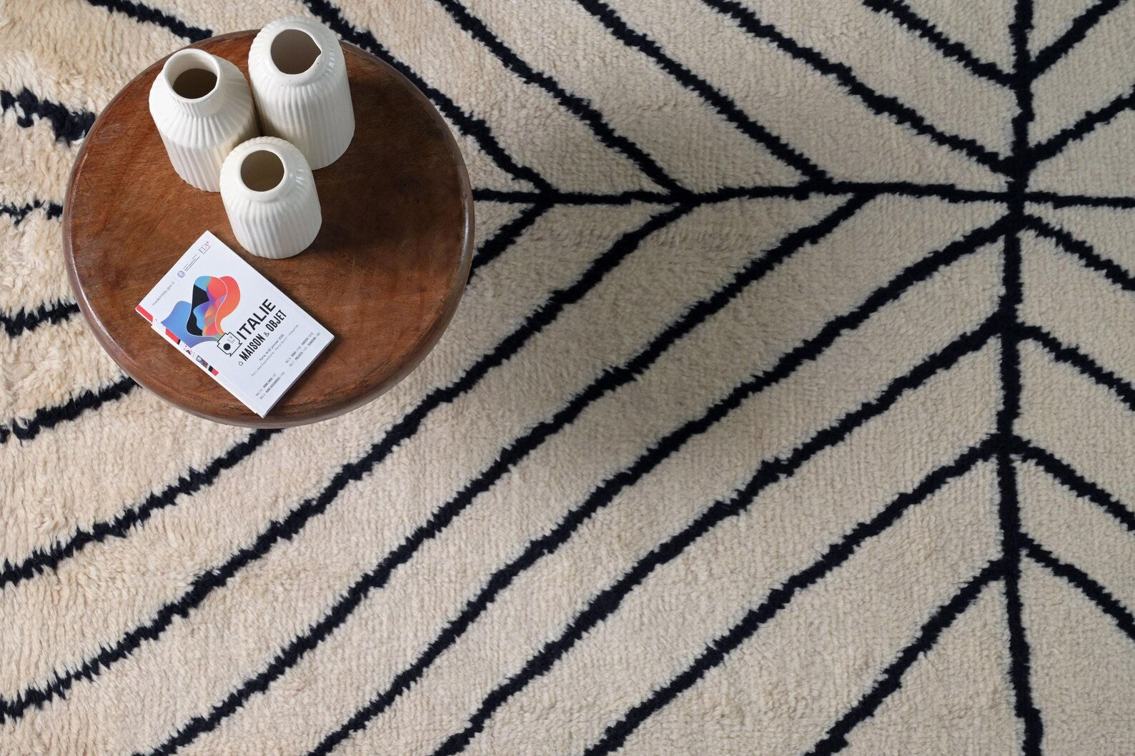 Stemline Rug styled in a modern interior with warm tones emphasizing its clean linear pattern
