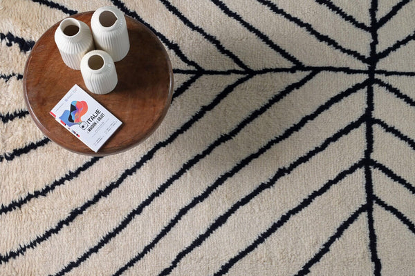 Stemline Rug styled in a modern interior with warm tones emphasizing its clean linear pattern