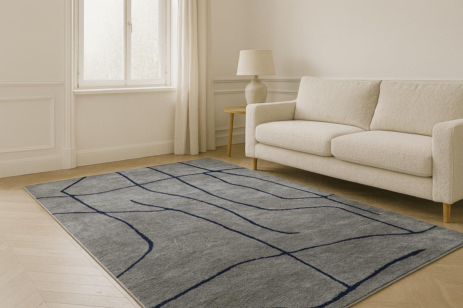 Abstract Line Art Grey Rug placed in a modern living room with soft grey base and dark linear pattern creating a contemporary feel
