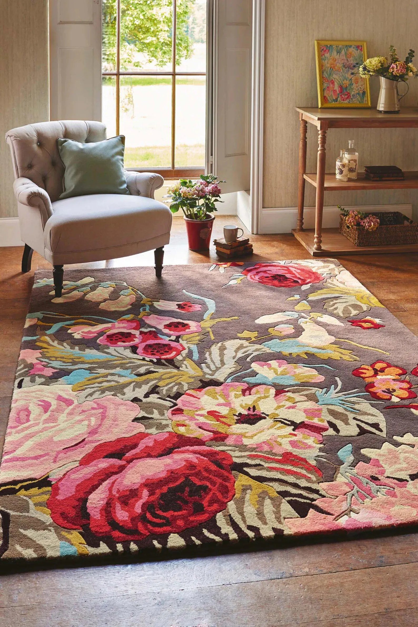 Summer Bloom Area Rug styled in a bright living room with floral design.