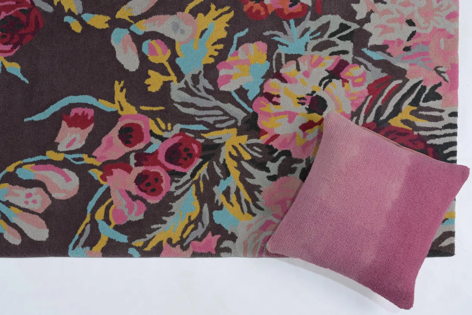 Summer Bloom Rug styled under sofa setup with bold floral appeal.