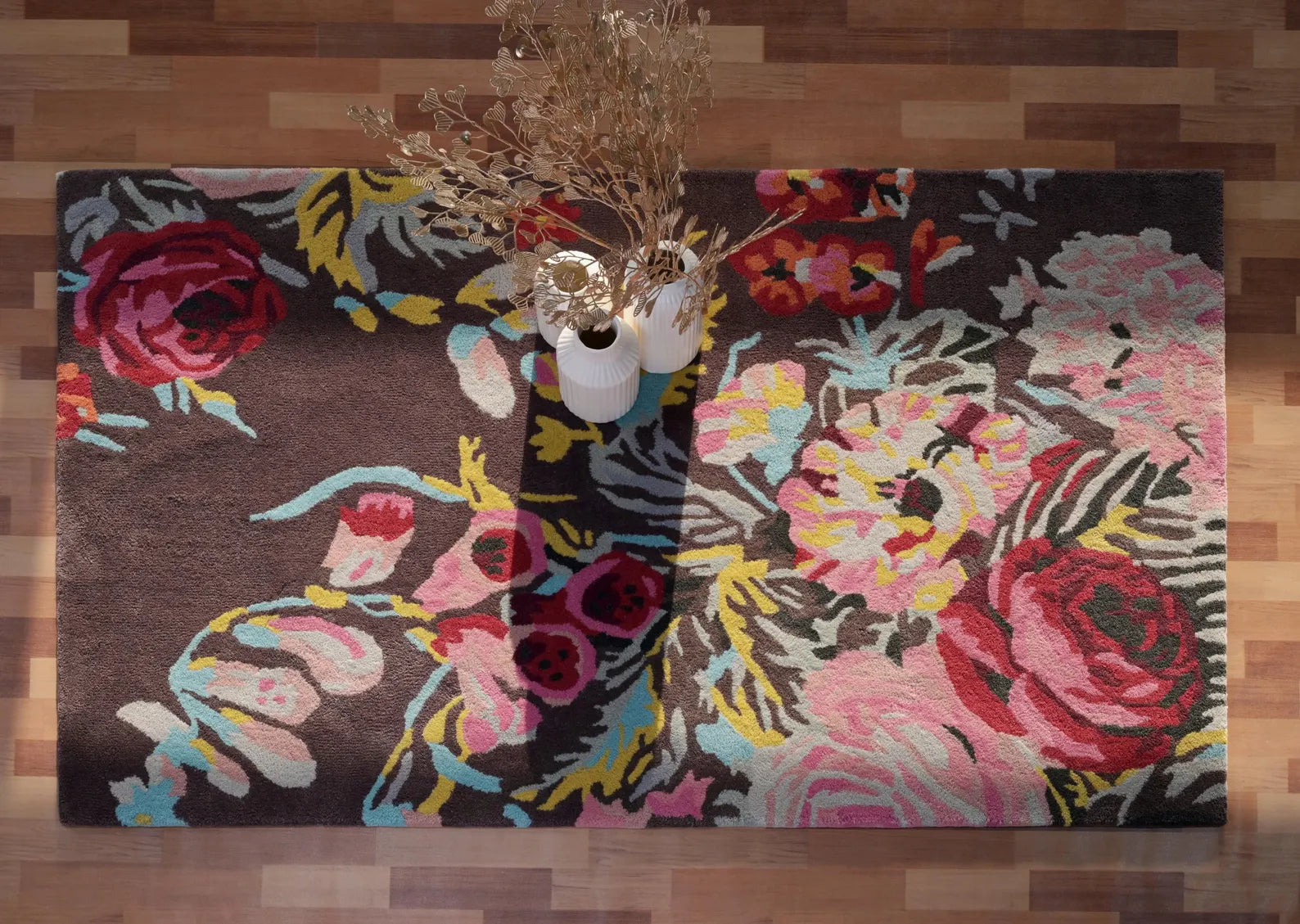 Summer Bloom Area Rug styled in  interior with artificial plant pot