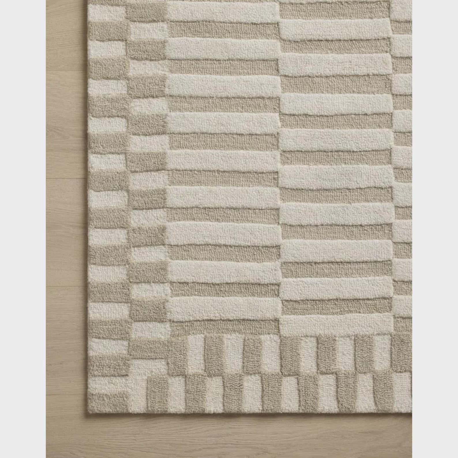 Tactile Grid hand tufted rug pattern detail showing high low carving and clean geometric alignment