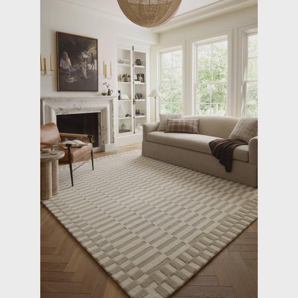 Tactile Grid Rug styled in a modern living room with soft neutral tones and wooden furniture