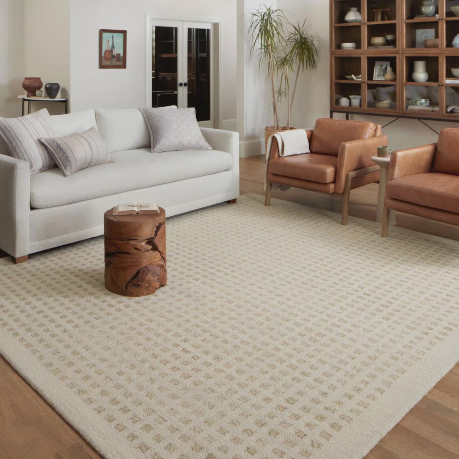 Tessel hand tufted rug styled in a warm living room setup, blending seamlessly with earthy tones and natural light.