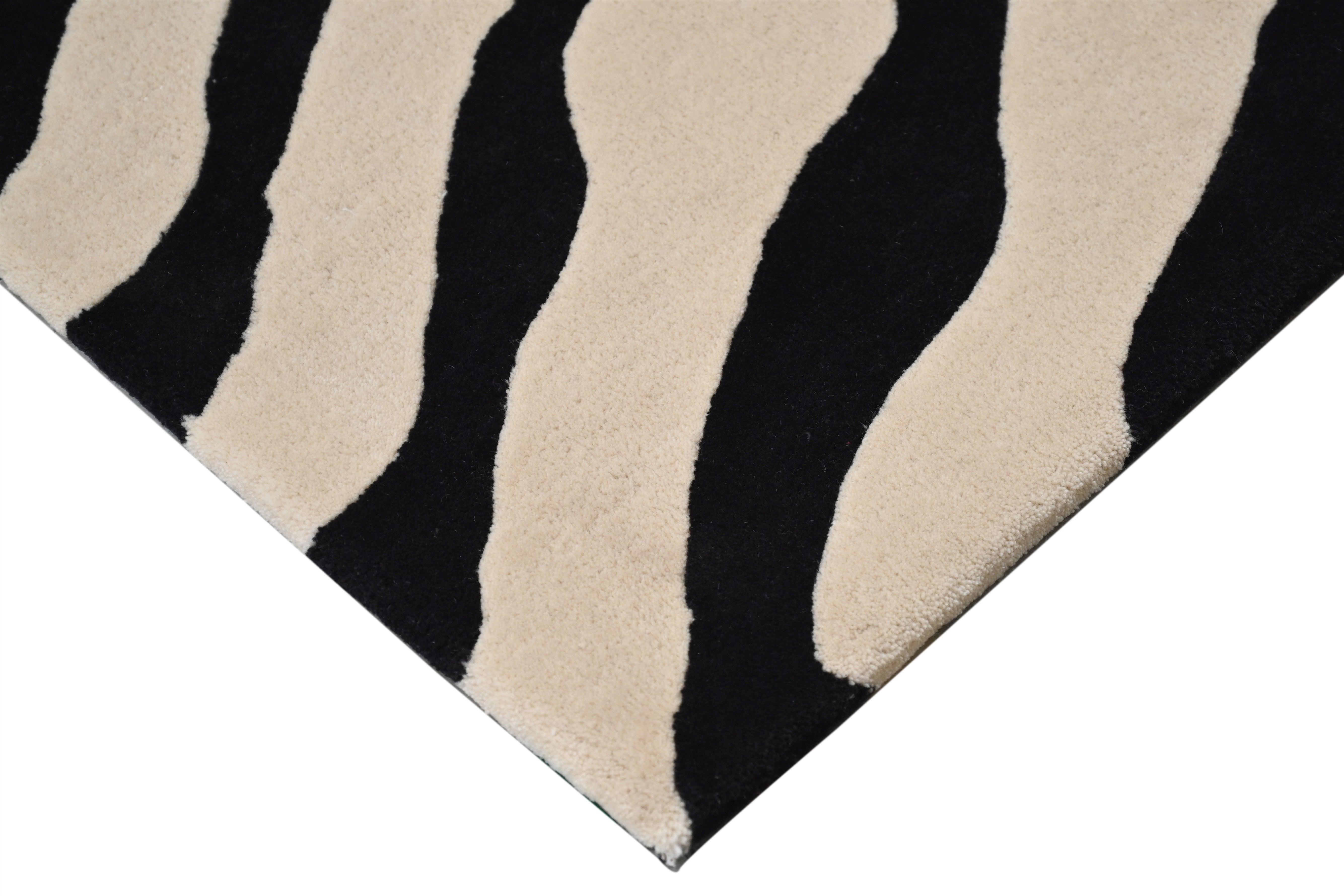 Close-up of Zebra Bloom Rug showing bold black-and-cream zebra stripes.