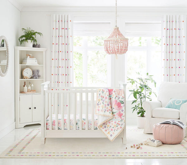 Candy Dots Rug styled in a cozy nursery with pastel accents and natural wood furniture