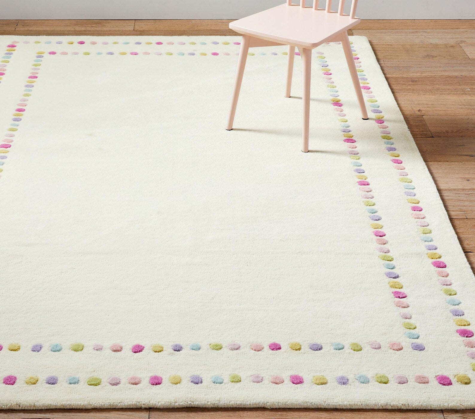 Candy Dots Rug top view showing colorful pastel dots forming a modern border design
