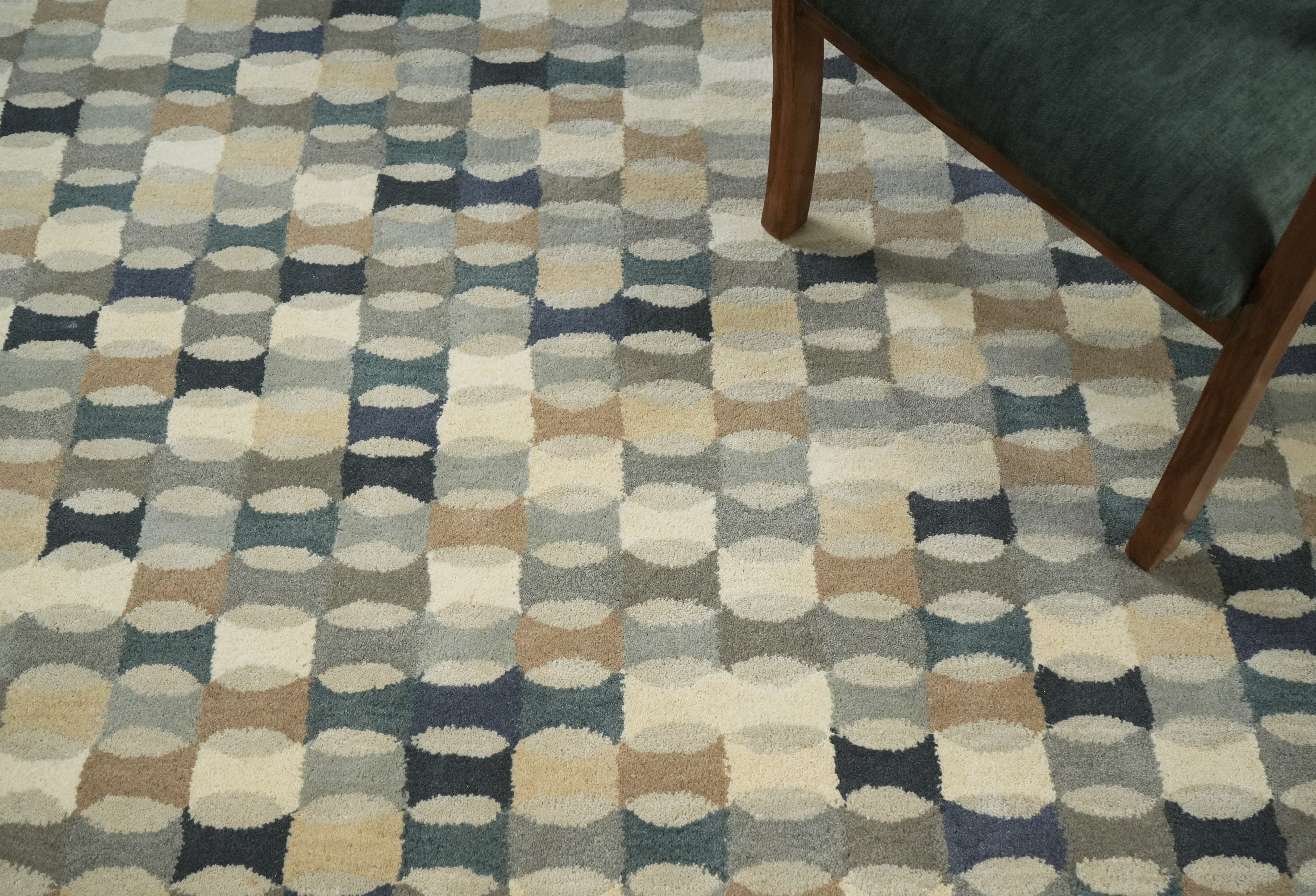 Capsule Grid rug styled under wooden coffee table in a minimalist living room