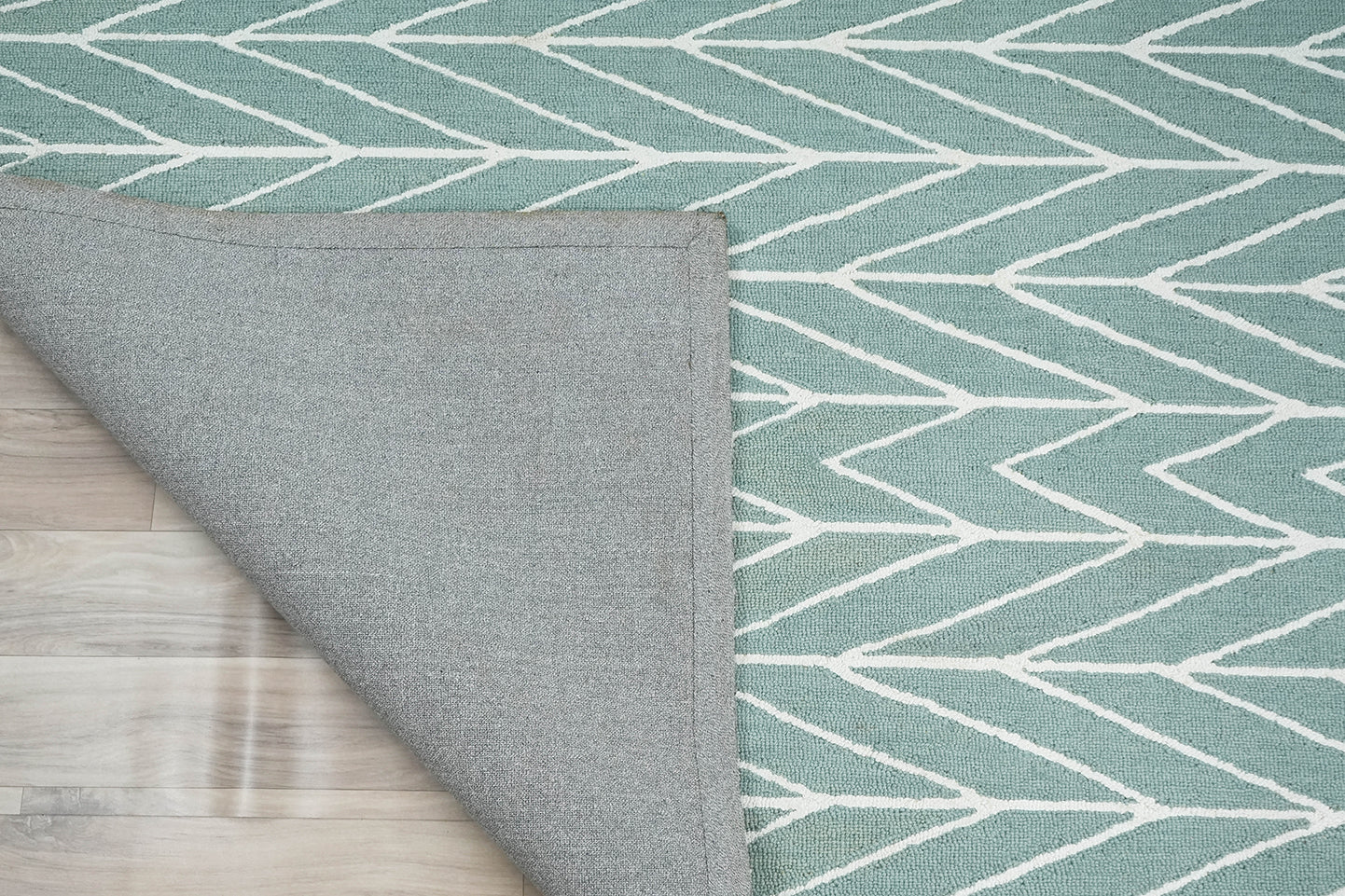Close-up detail of Chevron Drift hand tufted rug showing pile texture and chevron line work