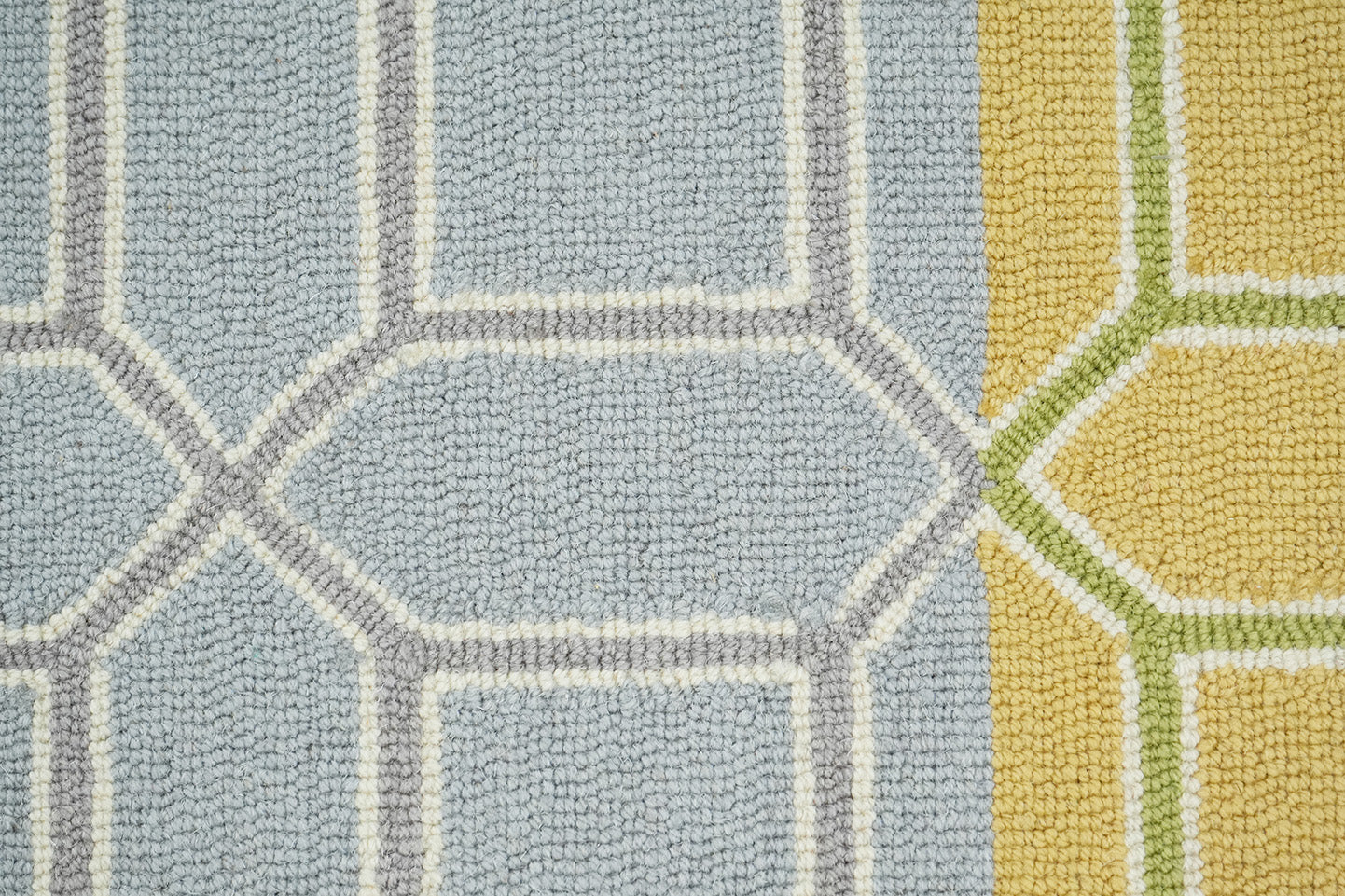Colorband Wool Rug made from 100 % New Zealand wool with hand tufted construction shown in close up detailing the textured pile and geometric lattice pattern