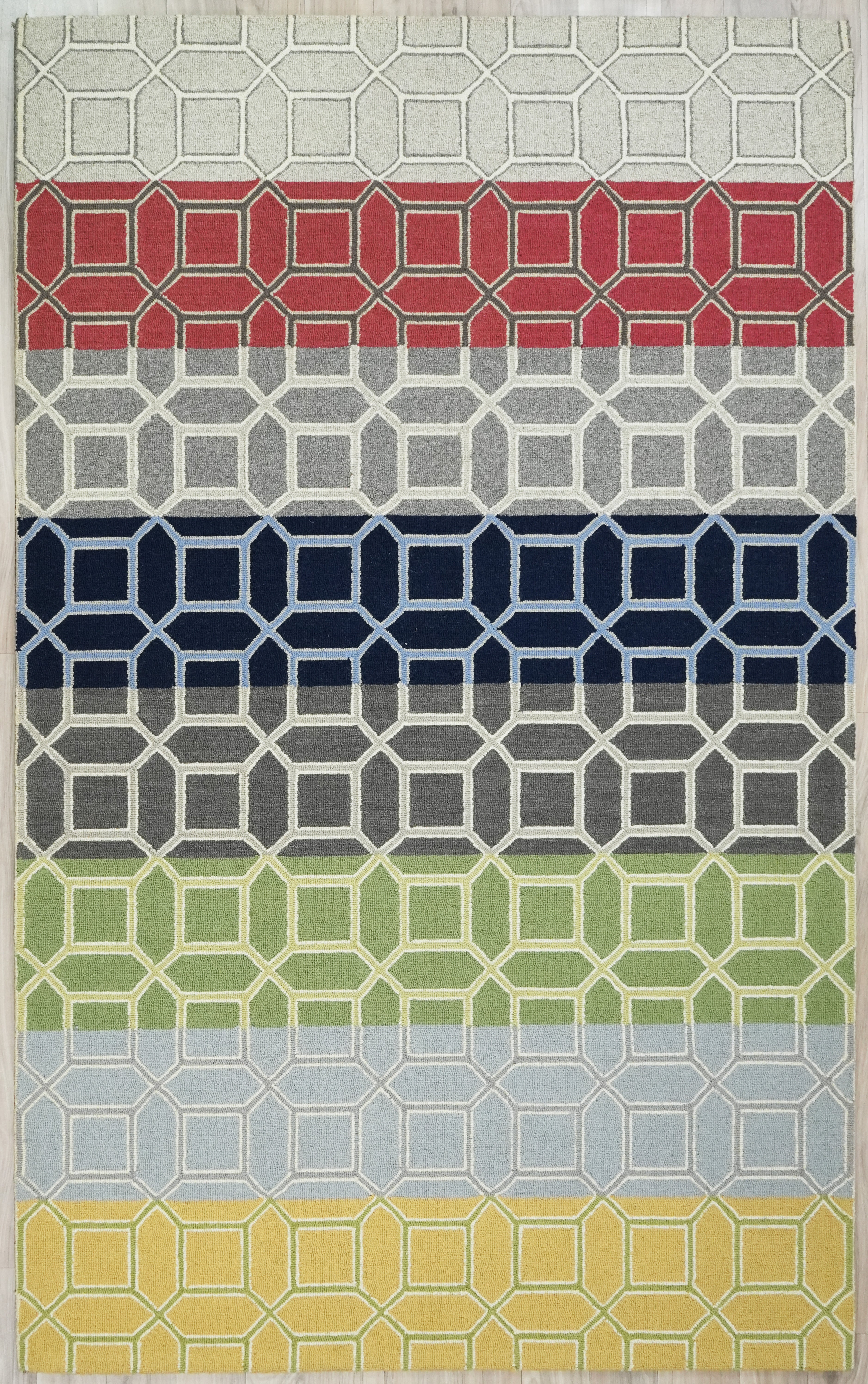 Colorband Wool Rug made from 100 % New Zealand wool with hand tufted construction shown in full view featuring horizontal color bands and repeating geometric lattice pattern