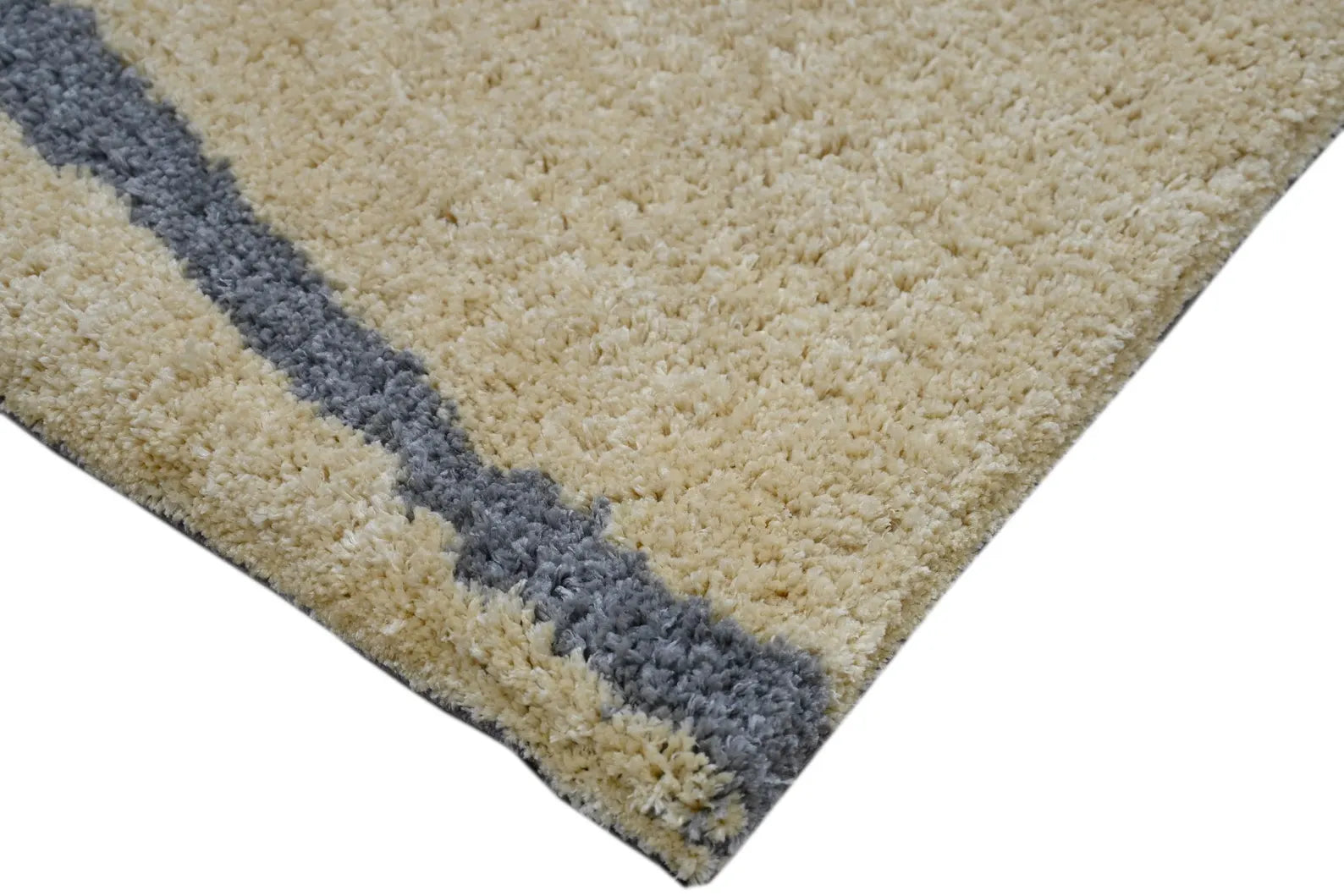 Side corner Dreamliner Line Art Rug detail view of table tuft texture and stitching.