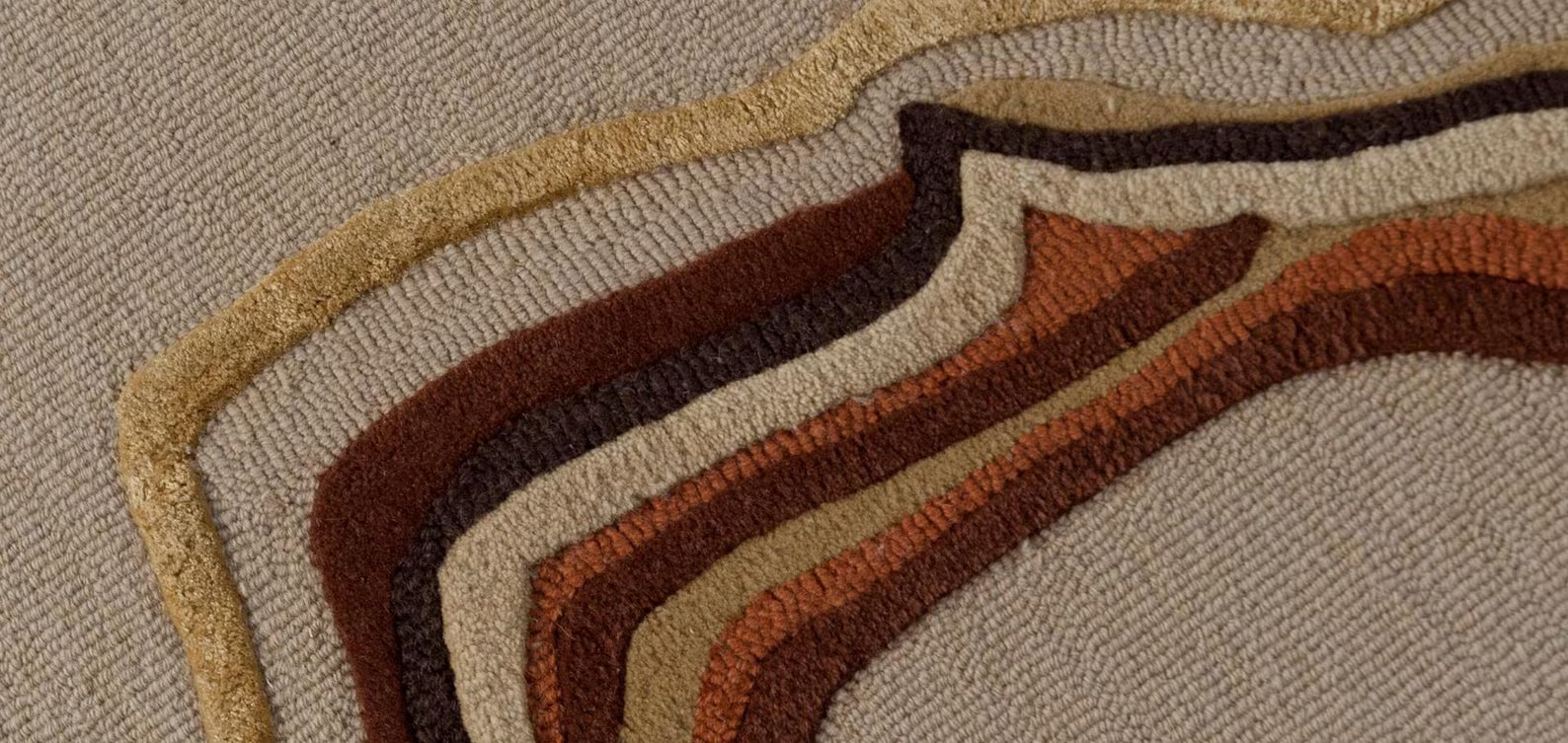 Modern Abstract Rug featuring marble-like swirls in rust, ochre, and cream shades.