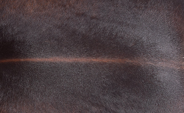 dark brown handmade leather pouf ottoman texture close up