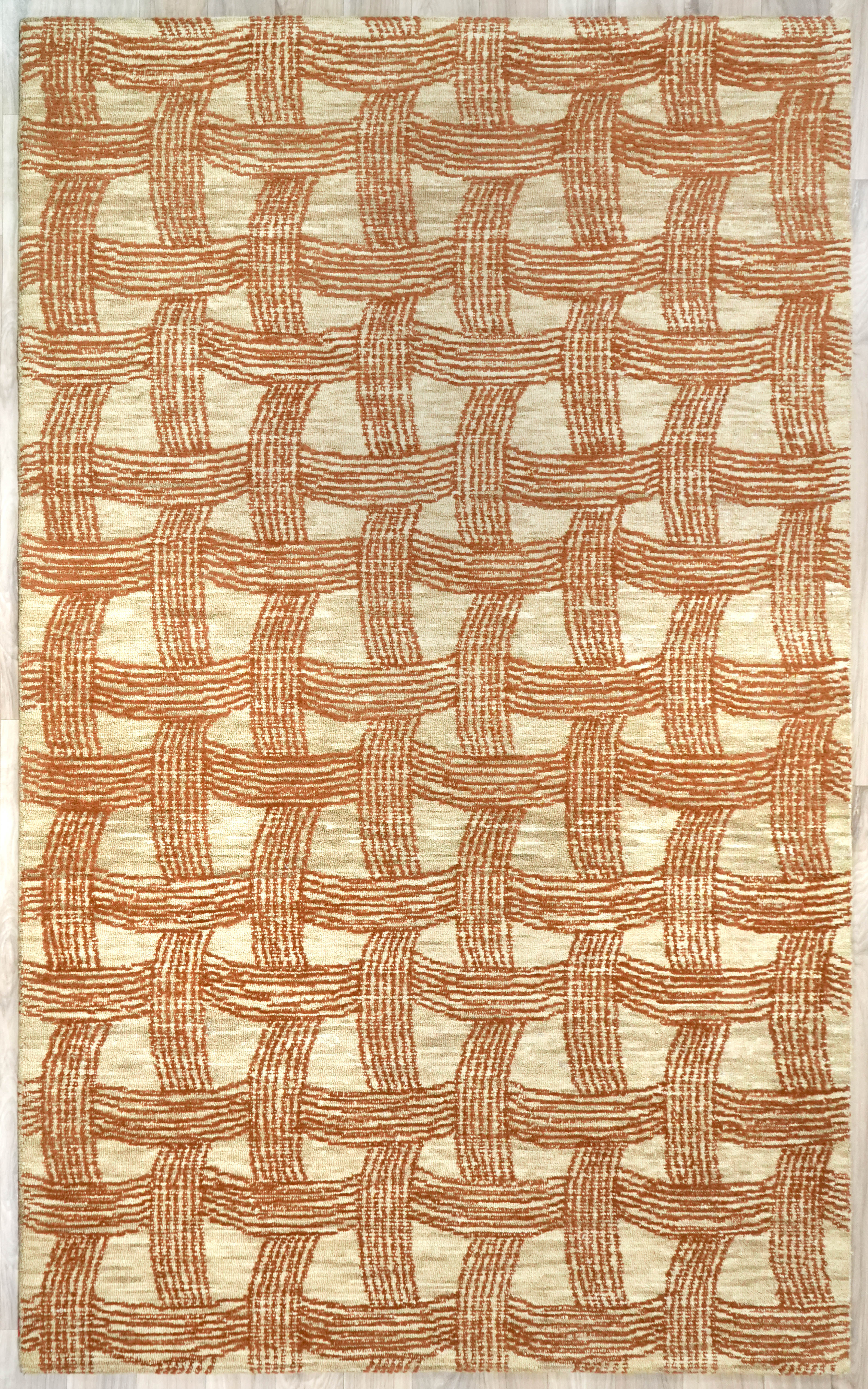 Full view of Ember Weft Pattern hand tufted rug featuring a woven grid design in cream and earthy orange tones
