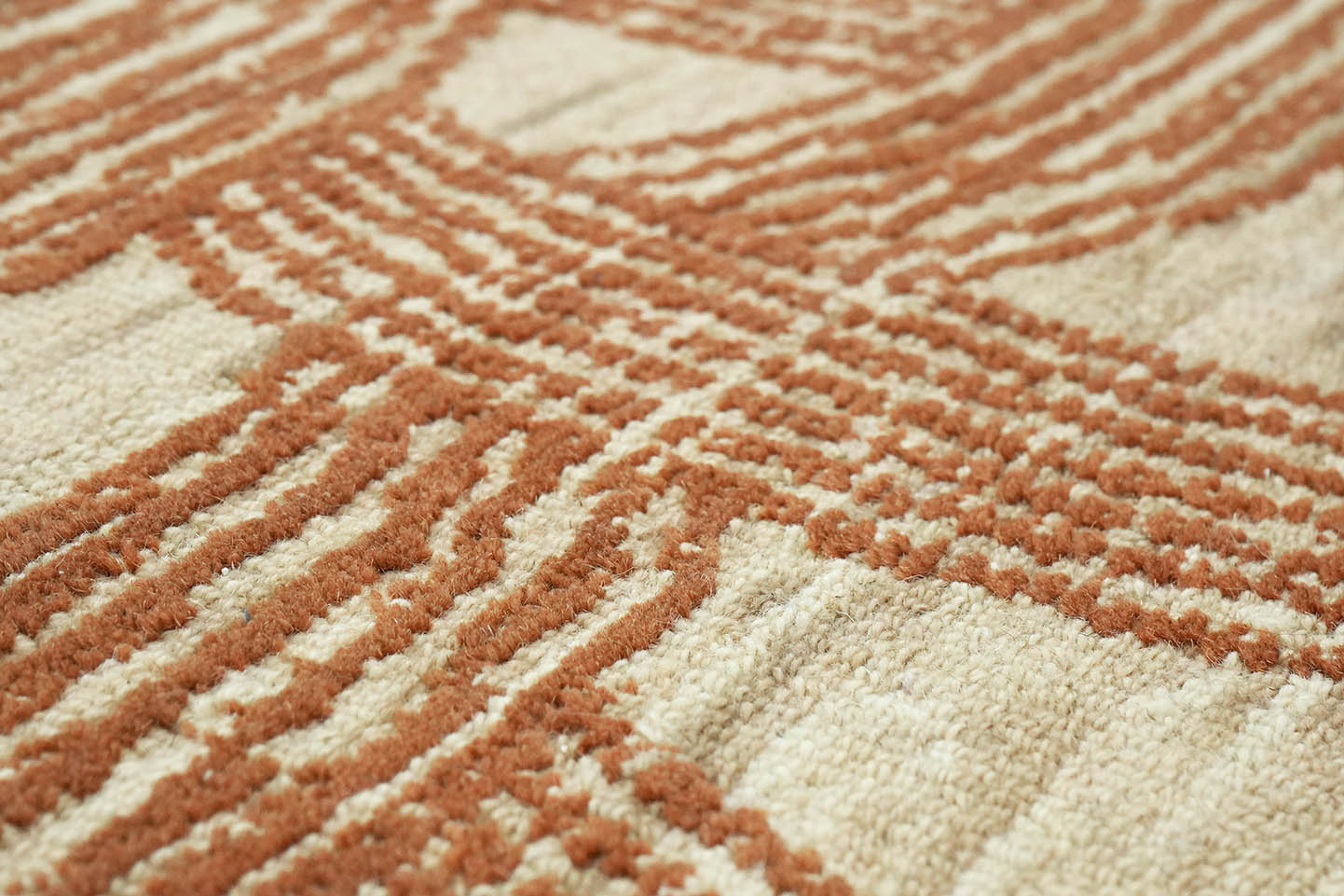 Close-up detail of Ember Weft Pattern hand tufted rug showing pile texture and layered weft pattern