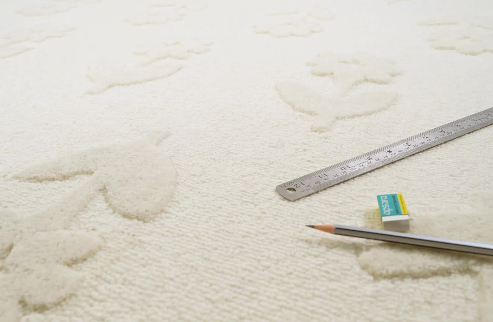 Flourish Rug pattern view showing delicate floral motifs and subtle depth