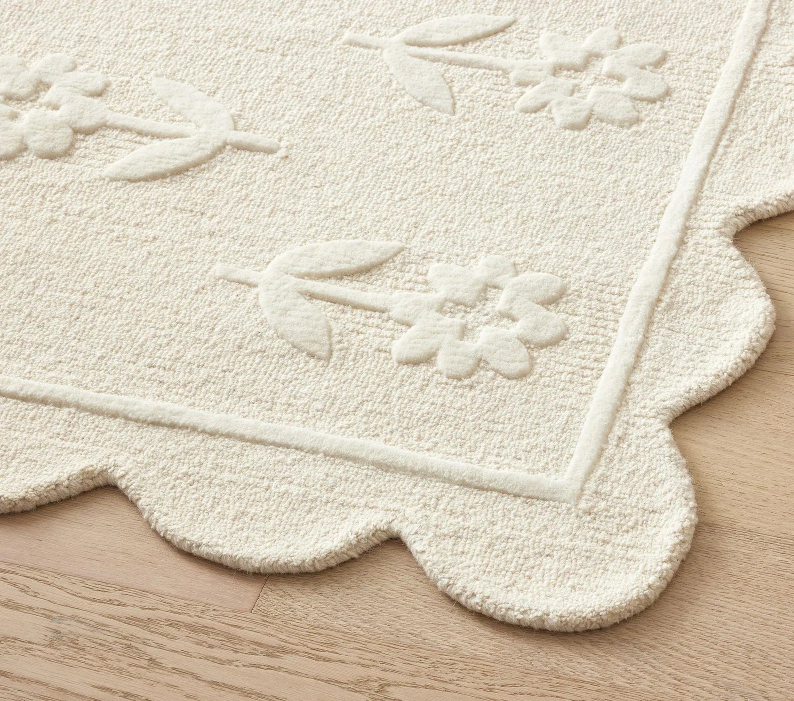 Flourish Rug side view highlighting sculpted floral pattern and plush wool finish