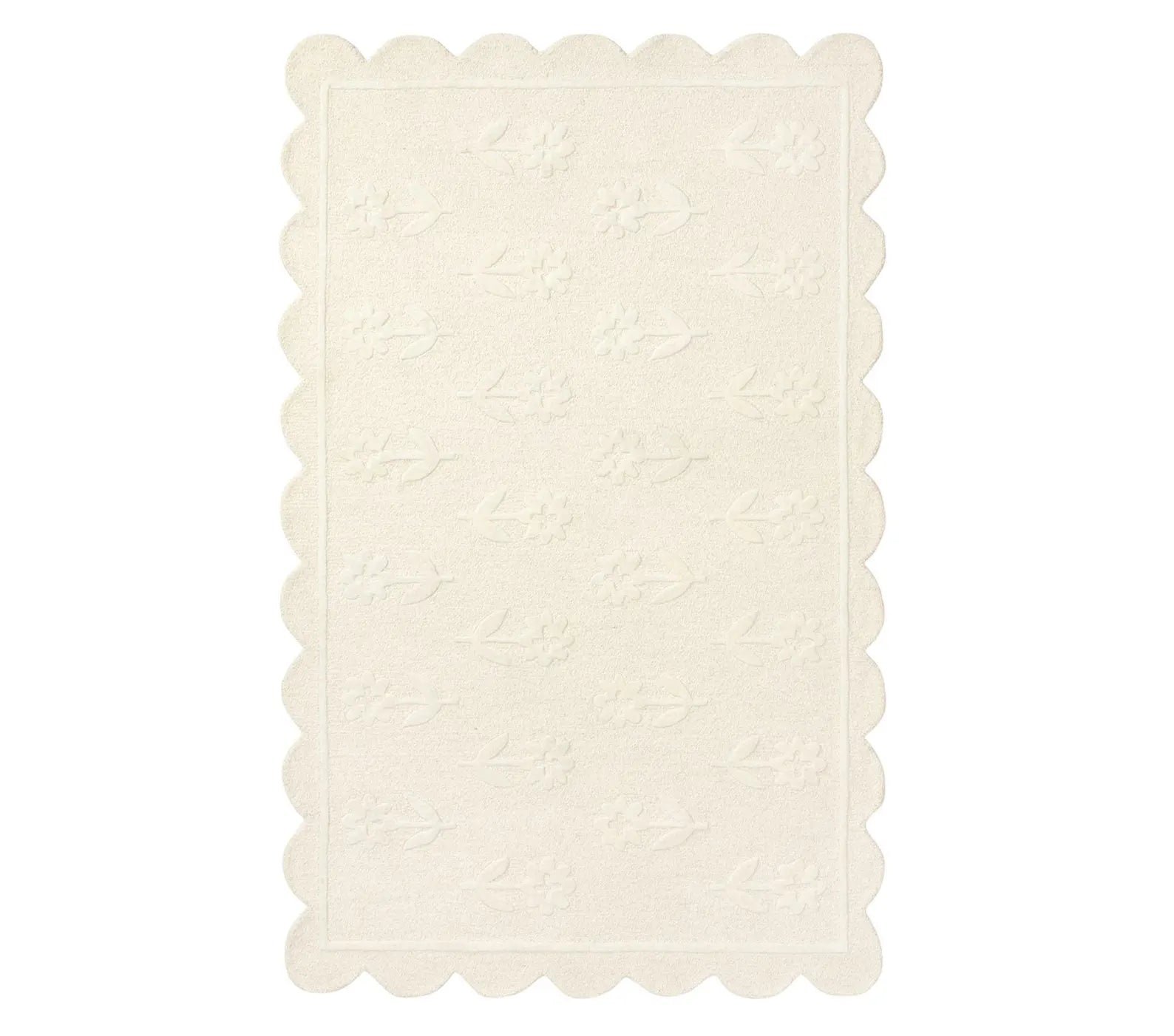 Flourish Rug top view showing tone on tone floral embossing and scalloped border