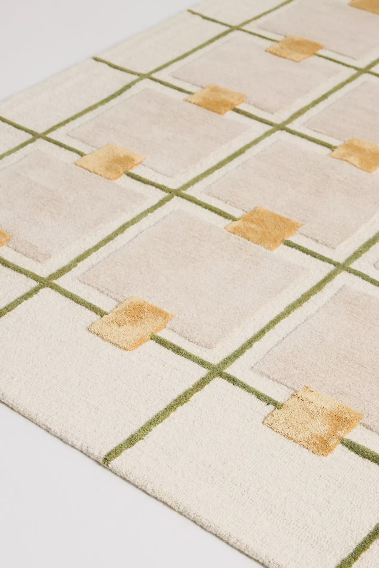 Hand-tufted geometric grid rug showing side profile and soft wool texture – Decordec