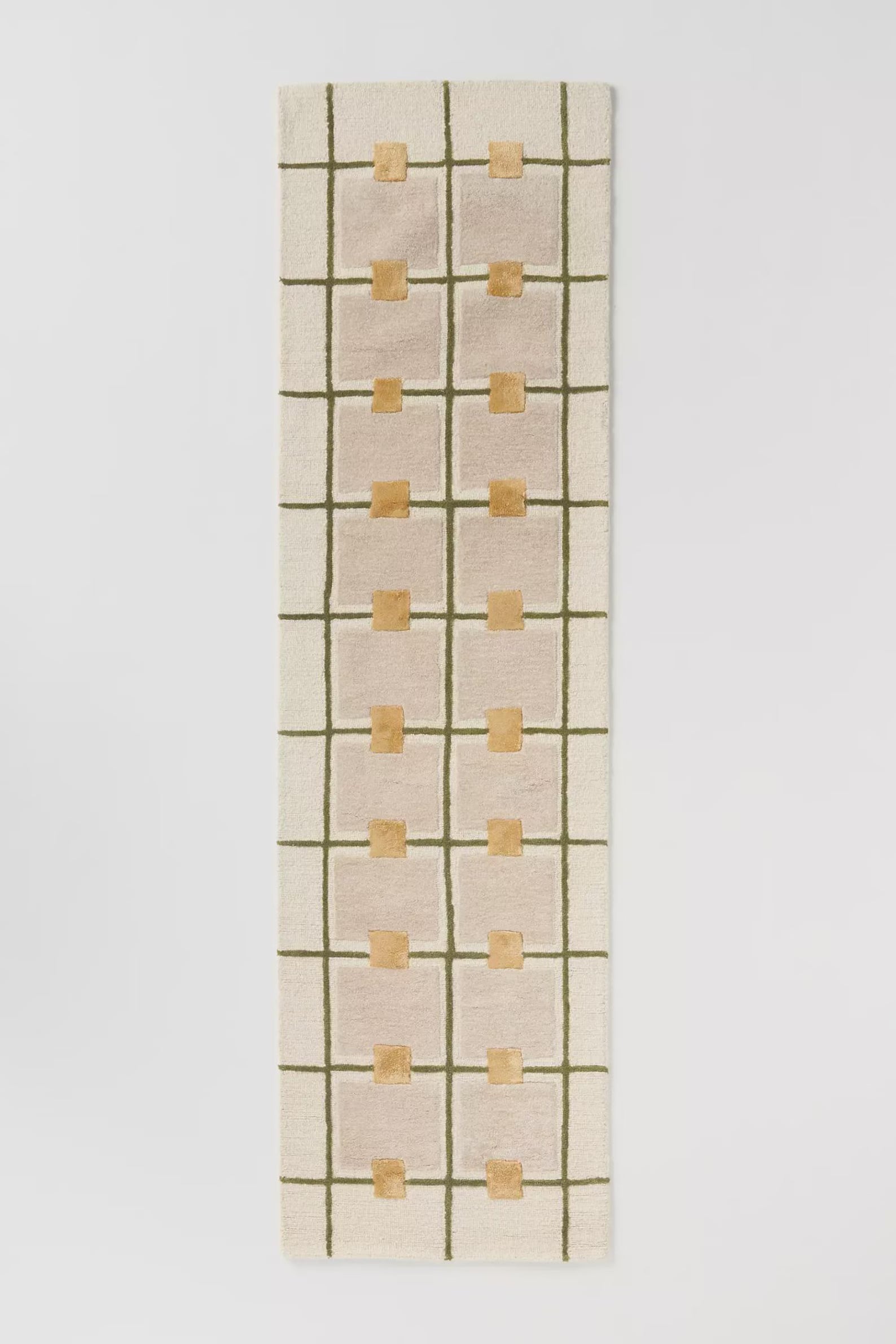 Hand tufted Daisy Frame Runner Rug displayed on a clean white background, showcasing its elongated floral grid design with warm beige and soft yellow tones.