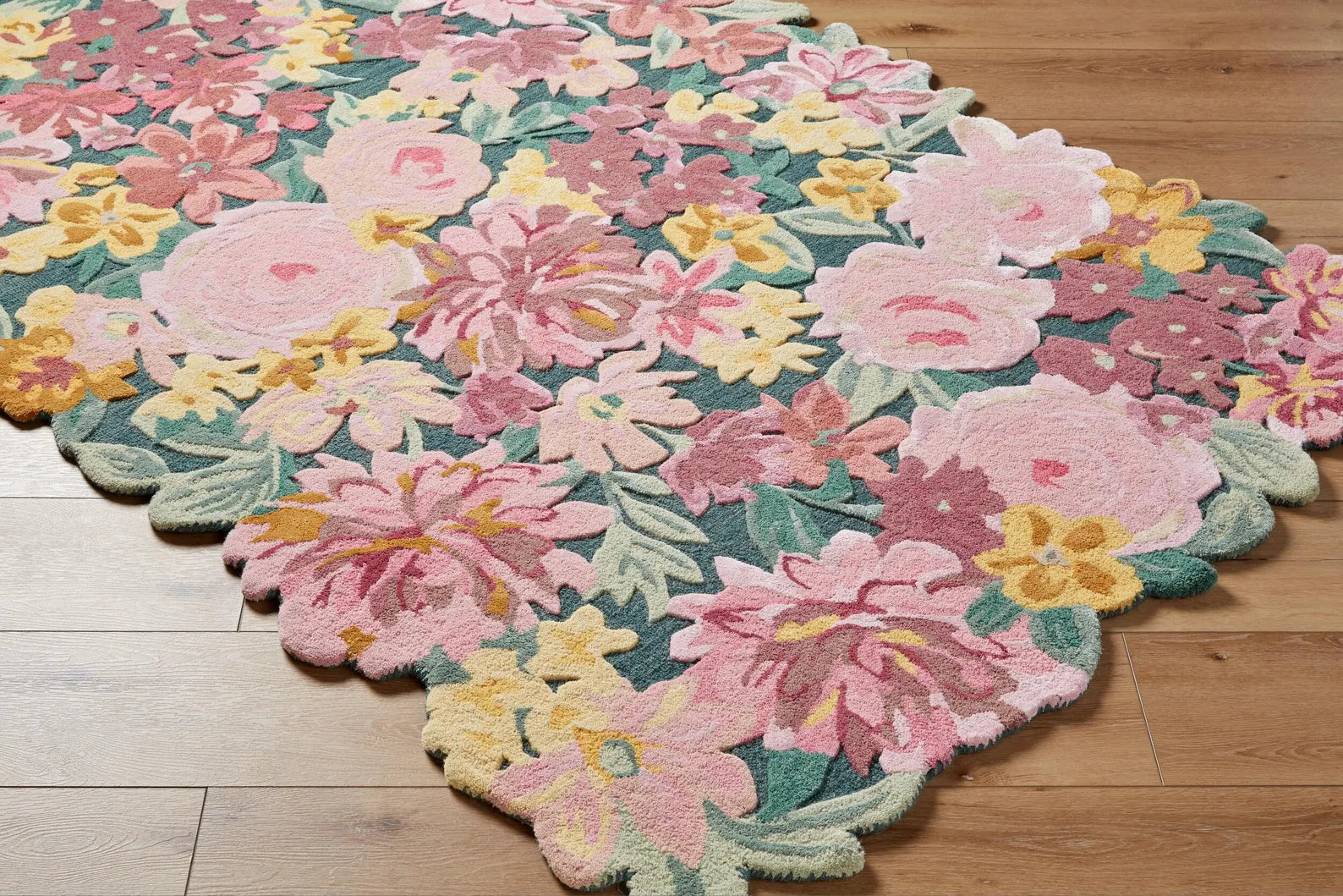 Hand tufted Floral Fantasy Wool Rug full view showcasing vibrant floral design in pink, yellow, and green tones with organic petal-shaped edges.