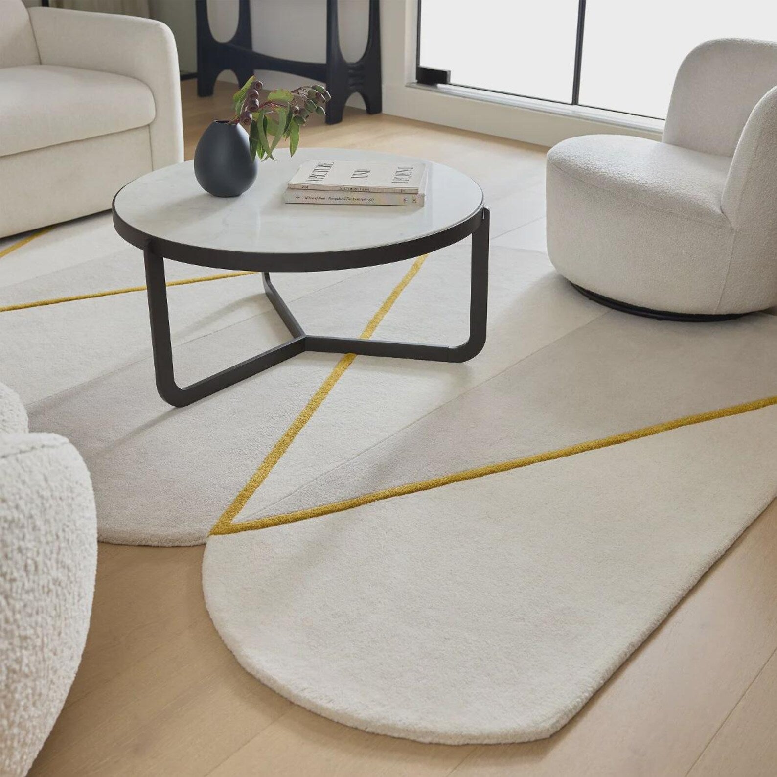 Hand tufted Rayform hand tufted rug styled in a modern living room featuring neutral furniture and soft daylight tones for a minimal luxury look.
