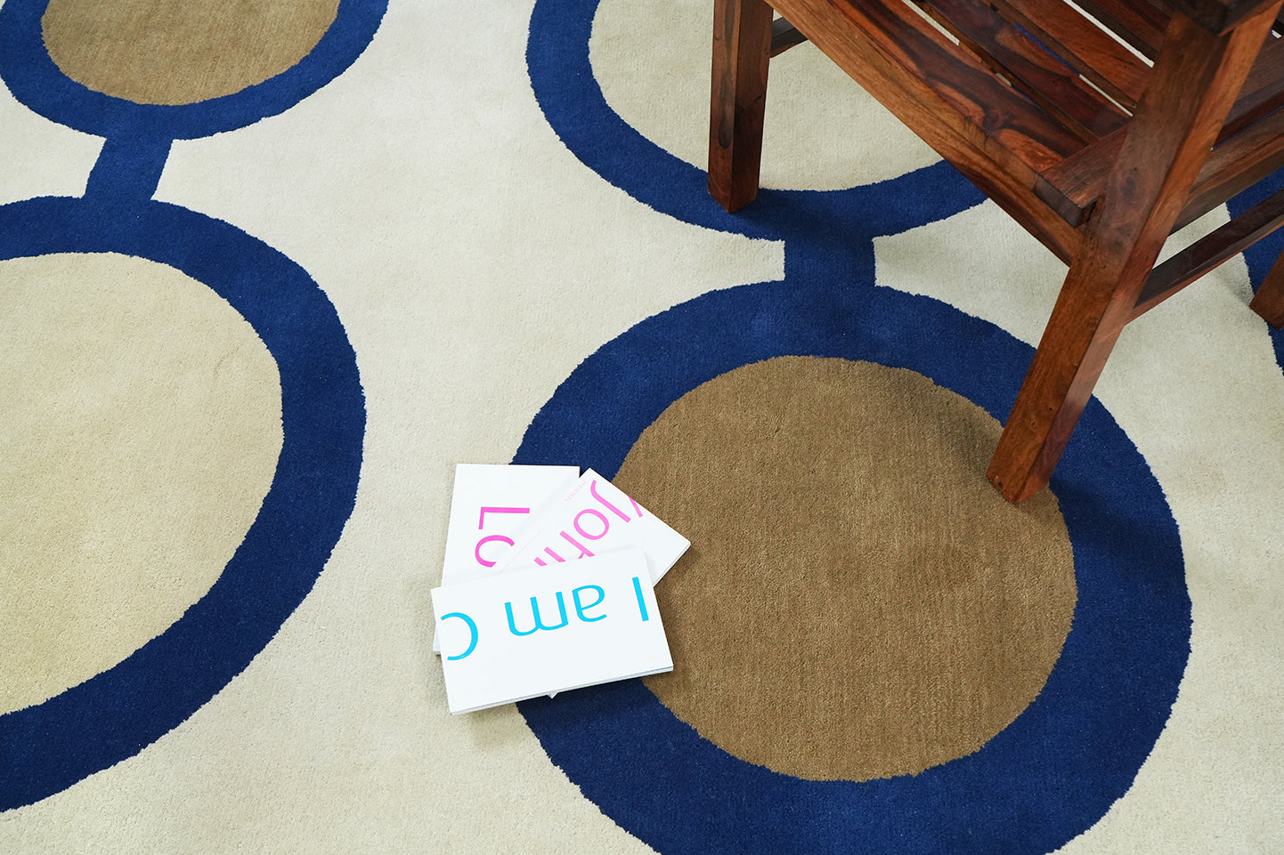 Interlinked Circle hand tufted rug styled in an interior setting showing scale, pattern, and color balance