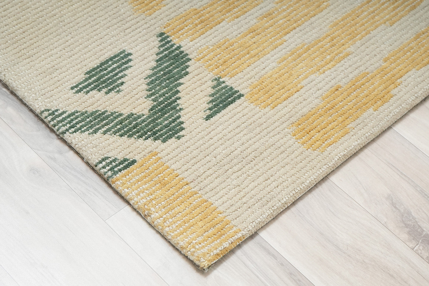 mosaic field wool rug corner view showing dense wool pile and geometric pattern