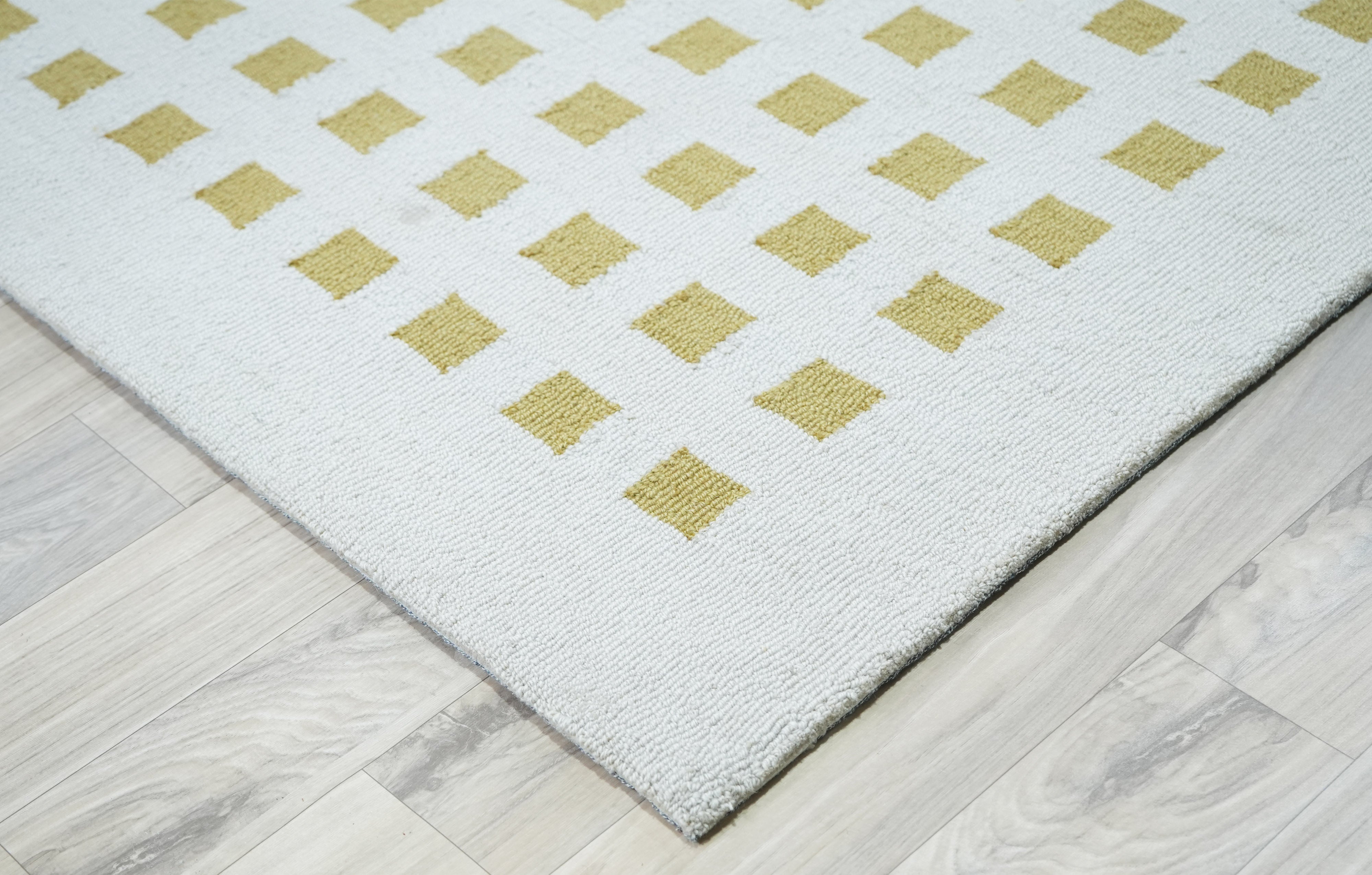 Orvex Grid Rug corner detail showing grid pattern and edge finish