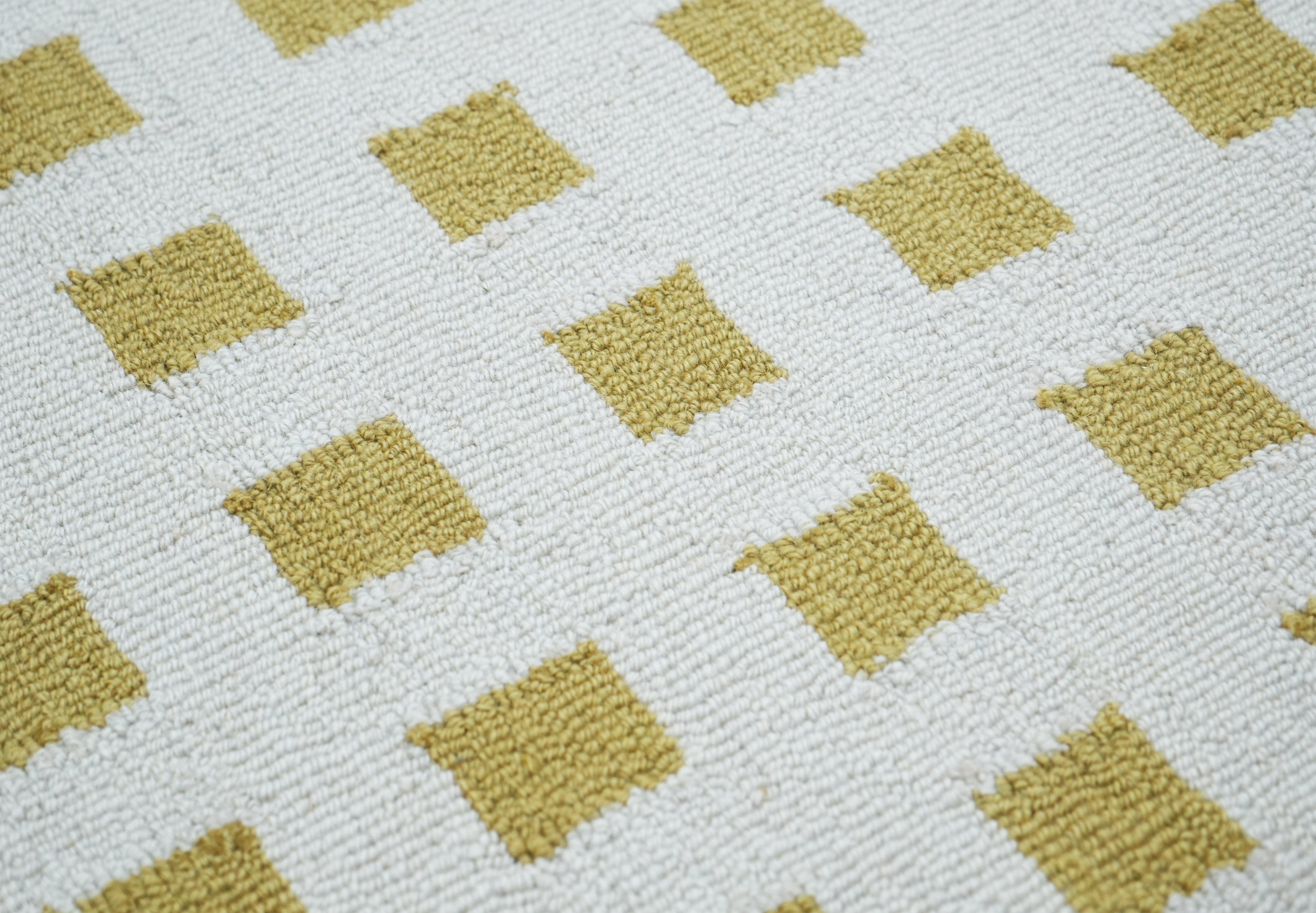 Orvex Grid Rug close up showing mustard squares and wool texture