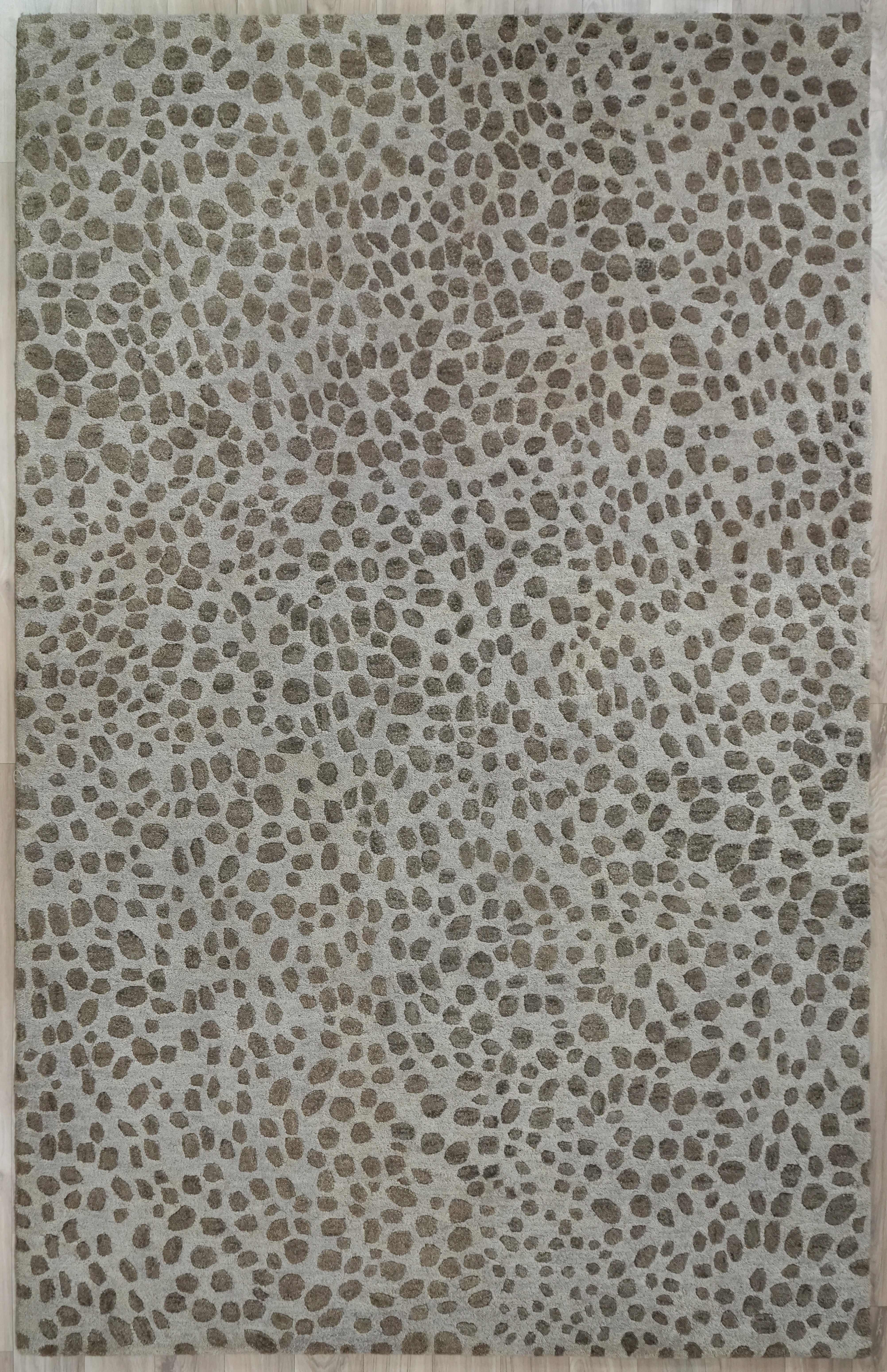 Full view of Pebble Design Wool Rug hand tufted from wool featuring an organic pebble pattern in off white and taupe tones