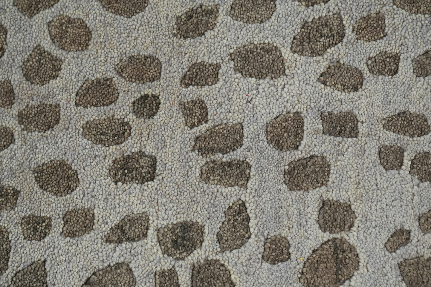 Close view of Pebble Design Wool Rug highlighting the organic pebble pattern and wool texture