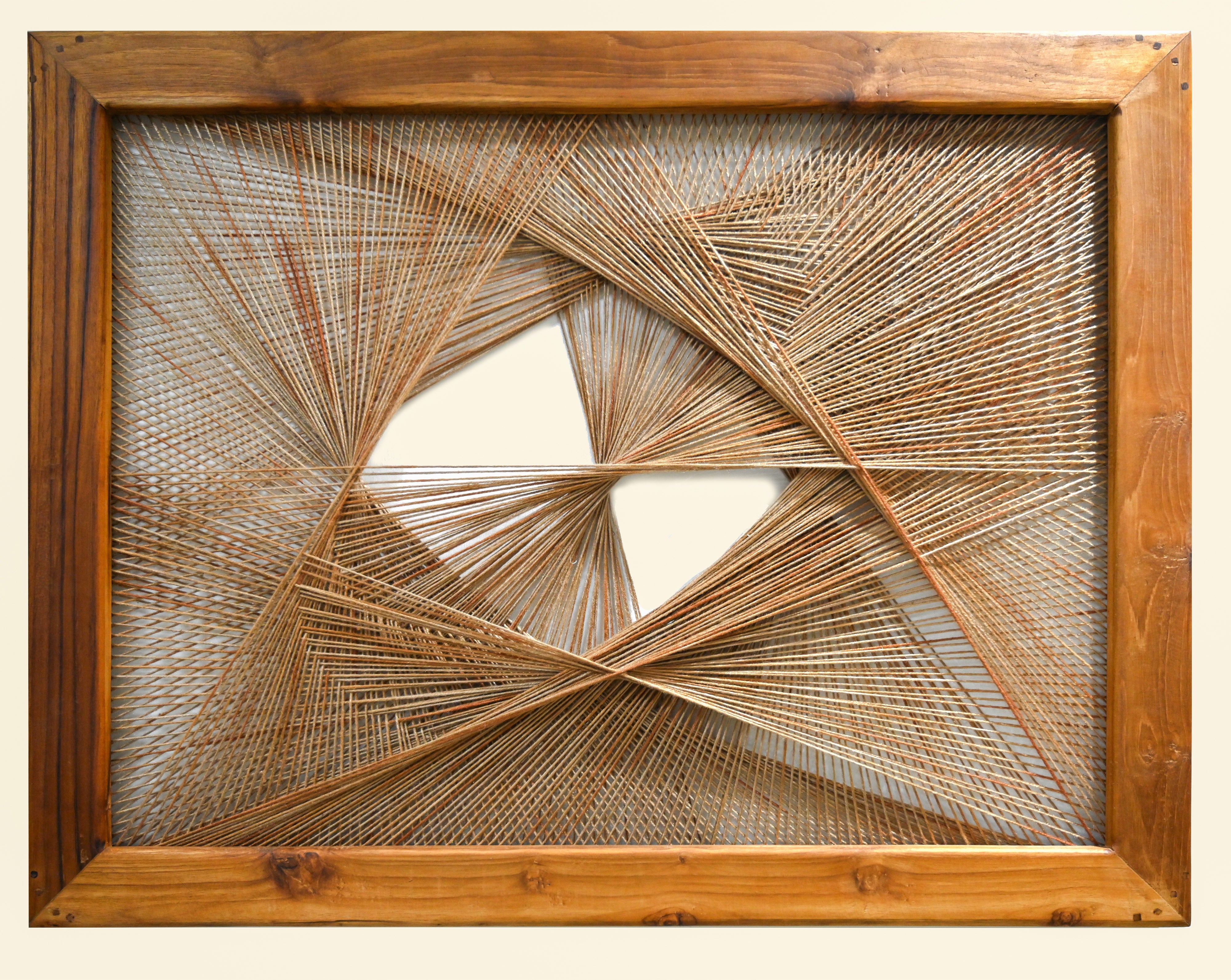 radiant axis woven wall art framed in natural wood with geometric thread design
