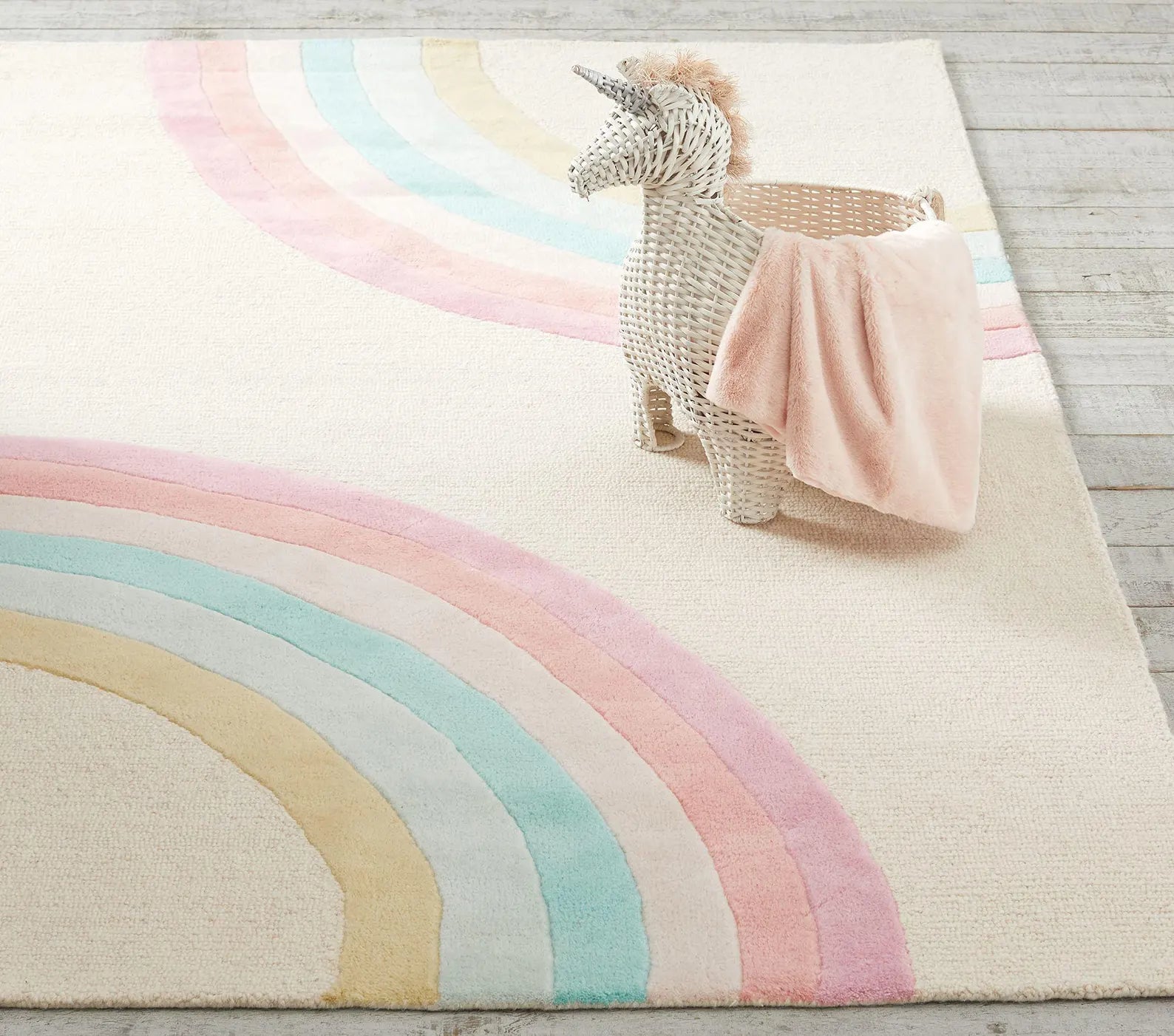 Rainbow Boho Rug styled top view showing playful pastel rainbow pattern on cream base