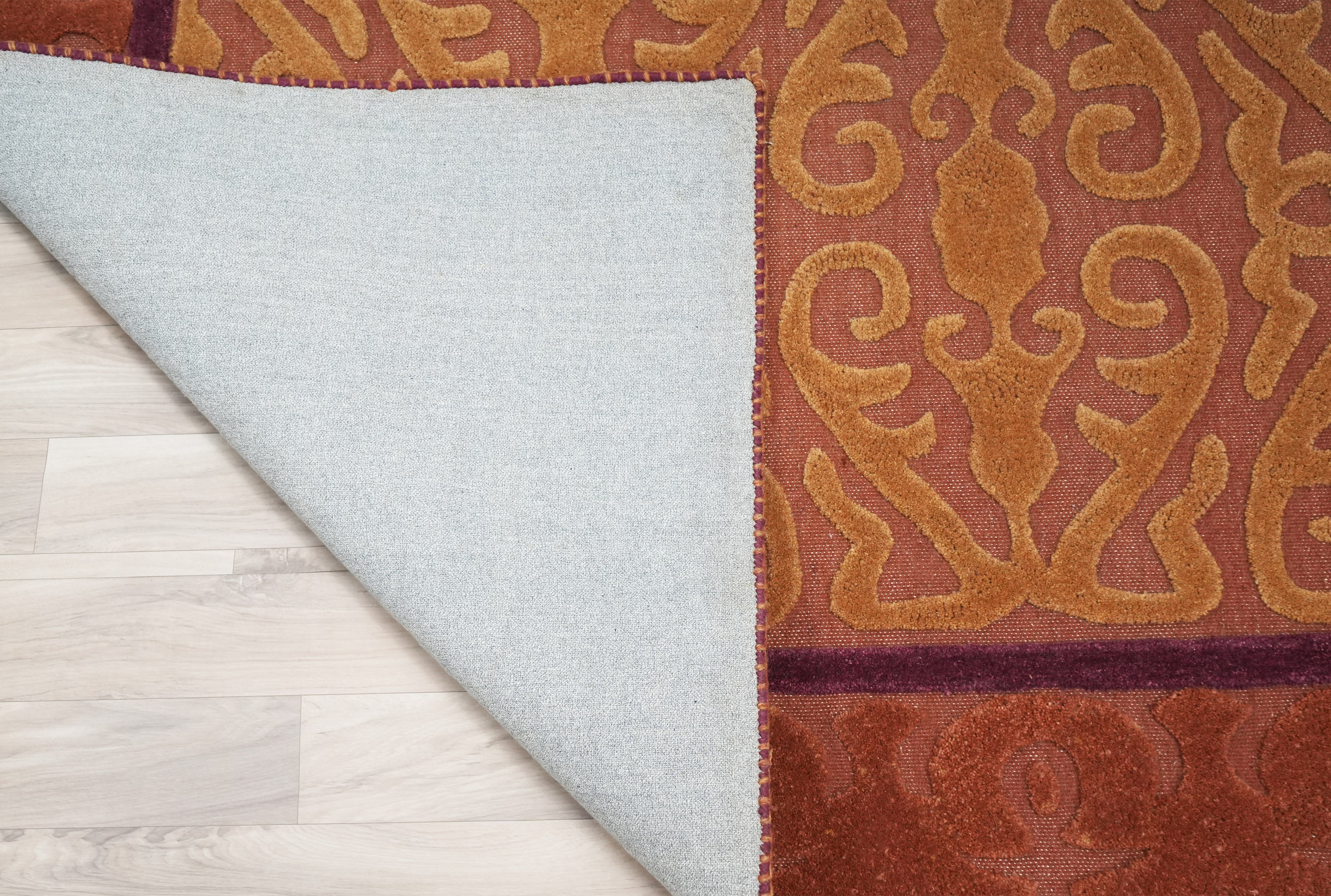 Saffron Dynasty rug backside showing construction and finishing detail