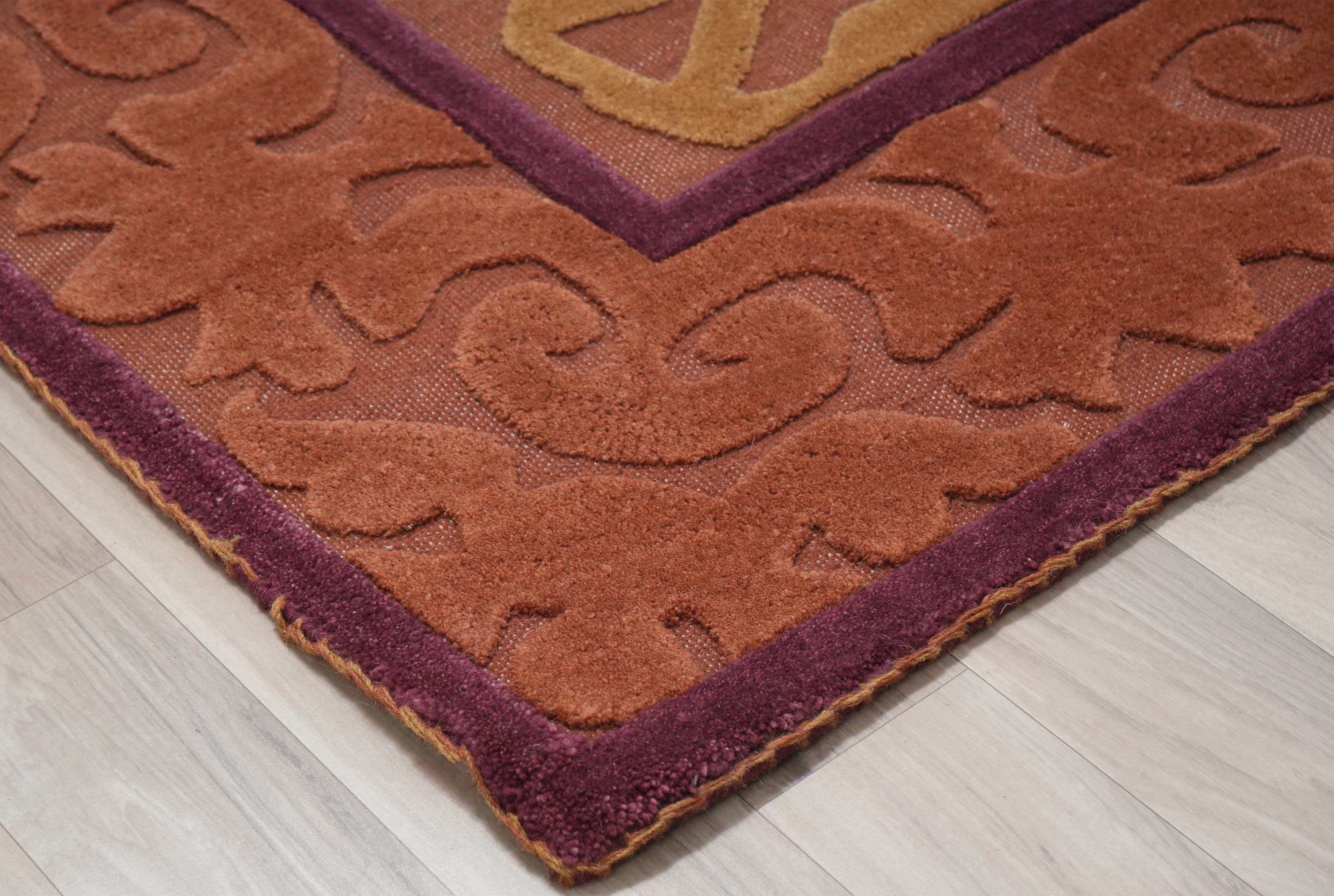 Saffron Dynasty rug corner detail with layered border and ornamental pattern