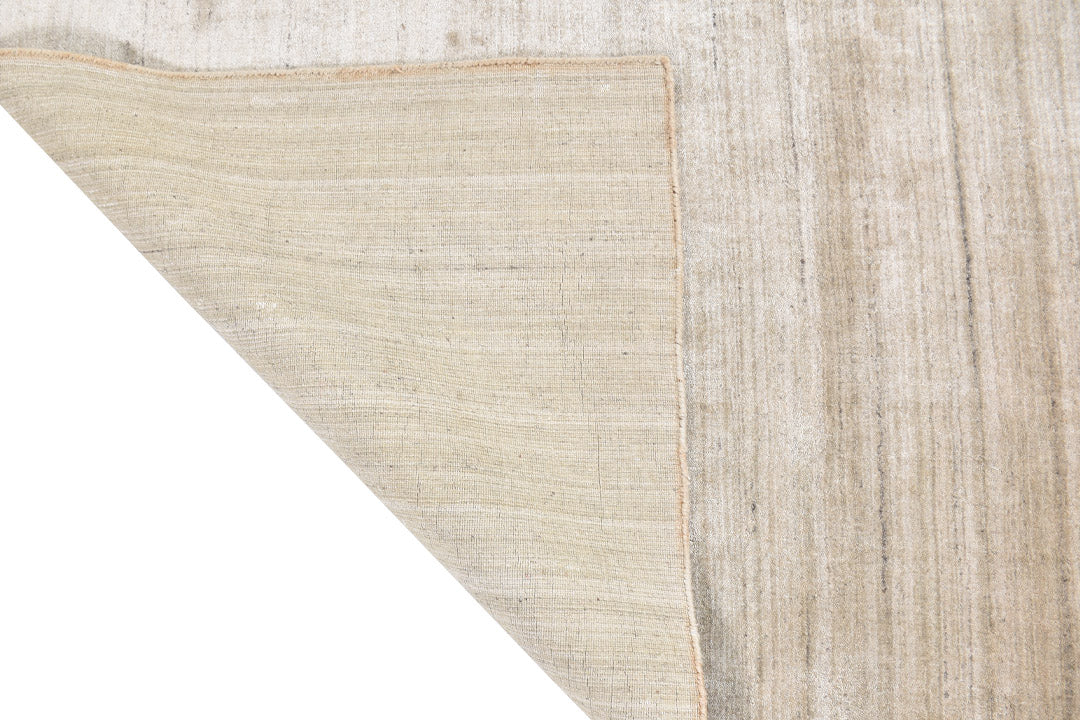 sand dune handloom textured rug backside corner view on white background