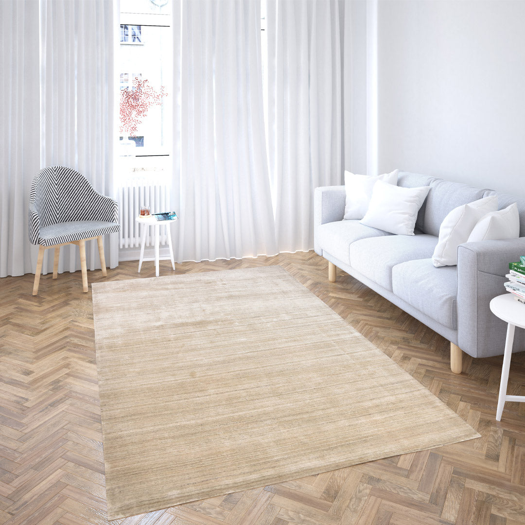 sand dune handloom textured rug styled in a bright interior