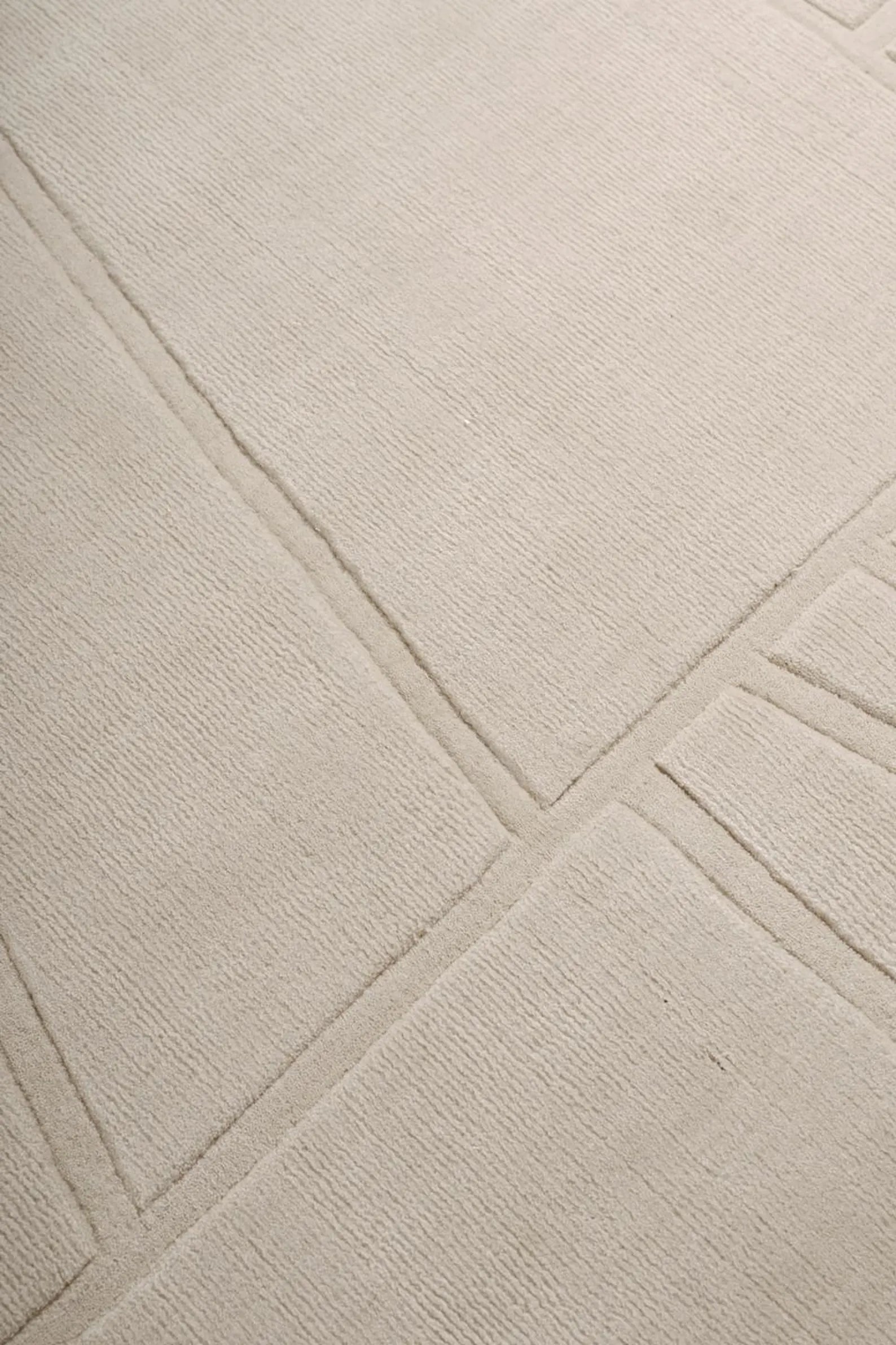 Script Rug beige variant showing tone on tone design with elegant geometric detailing