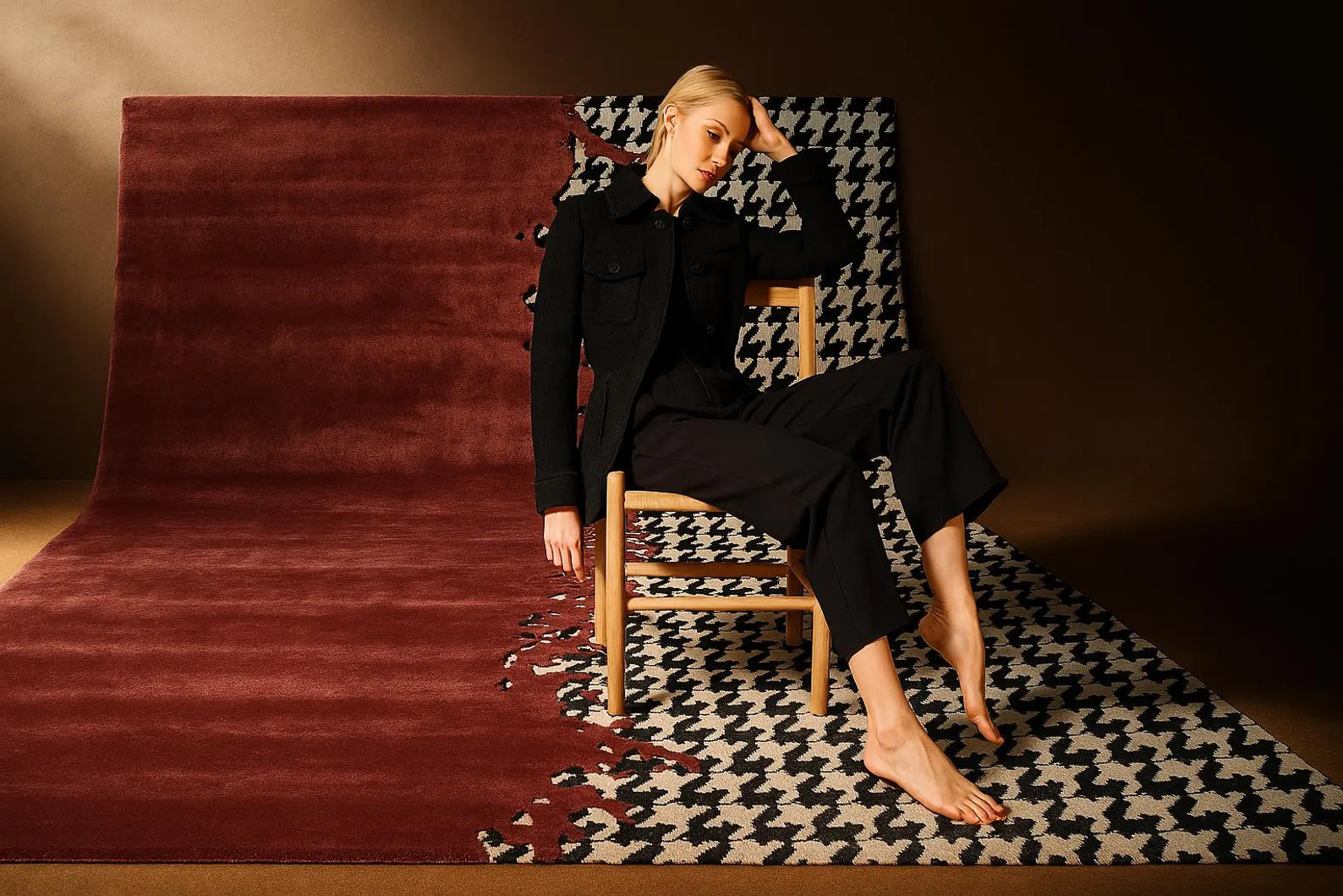 Split Houndstooth hand tufted rug styled in a modern room with deep red and black houndstooth pattern